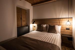 Postel nebo postele na pokoji v ubytování Casa Pasini-Foresteria