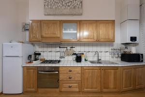 Η κουζίνα ή μικρή κουζίνα στο Piazza Oberdan-Carducci Elegant Apartment +20 φωτογραφίες