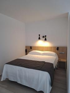 a bedroom with a large bed in a room at Sunside Ibiza Studios - Only Adults- Formerly known as Central Park in San Antonio