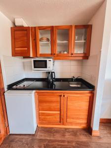 A cozinha ou cozinha compacta de Hotel Catedral Ski & Wellness