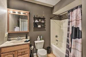 a bathroom with a sink and a toilet and a shower at Carolina Moon Cabin in Franklin +17 photos