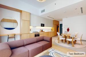 a living room with a couch and a table at Mood Living 45 in Dubai +36 photos