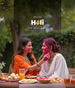 two women sitting at a table with food at ELIVAAS 2 BHK Pet Friendly Villa with Pvt Pool - Heaven in Hill in Udaipur