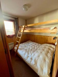 Postel nebo postele na pokoji v ubytování Appartement Chalets du Pounant