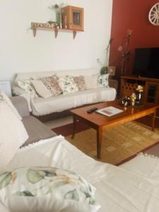 a living room with two couches and a coffee table at Cozy Place living in Kozani
