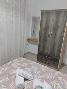 A bed or beds in a room at Eirinis home