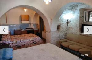 Postel nebo postele na pokoji v ubytování Alloggio in trullo con bagno indipendente