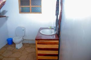 a bathroom with a sink and a toilet at Hillstone Safari Lodge in Kimana +44 photos