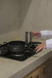 a pot on top of a stove in a kitchen at Dannys Madiha in Kamburugamuwa