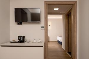 TV a/nebo společenská místnost v ubytování Palatino Hotel