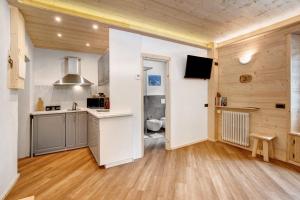 a kitchen with a sink and a toilet in a room at Appartamento Centro Santa Caterina in Santa Caterina Valfurva