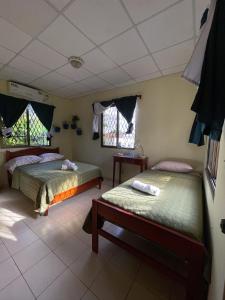 Voodi või voodid majutusasutuse Hostel Kimmell / Hostal Familiar La Casita De Los Kimmell toas +31 fotot