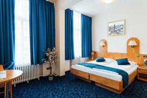 Postel nebo postele na pokoji v ubytování Steens Hotel Alster City