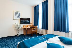 Postel nebo postele na pokoji v ubytování Steens Hotel Alster City