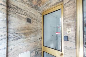 a door to a building with a stone wall at Lisbon Apartment 3 in Lisbon +5 photos