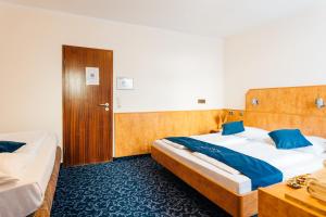 Postel nebo postele na pokoji v ubytování Steens Hotel Alster City
