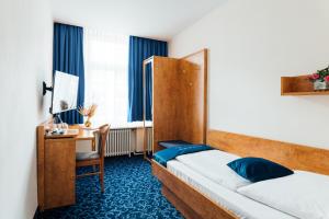 Postel nebo postele na pokoji v ubytování Steens Hotel Alster City