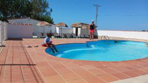 a young child sitting in front of a small pool at Kampaoh Delta del Ebro in Poblenou del Delta