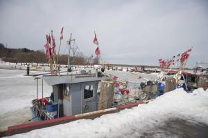 a boat is docked in the snow at Eisenbahnerhaus Klausdorf in Klausdorf Mecklenburg Vorpommern
