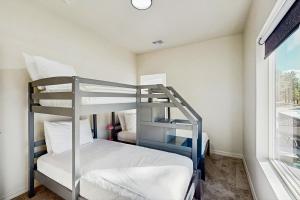 Postel nebo postele na pokoji v ubytování Peaks & Pines Bungalow