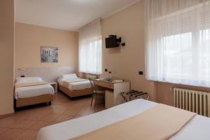 Postel nebo postele na pokoji v ubytování Al Centro + 25 fotografií