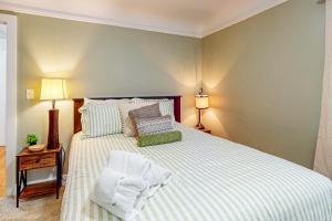 a bedroom with a bed with towels on it at MI Blue Mallard in Suttons Bay