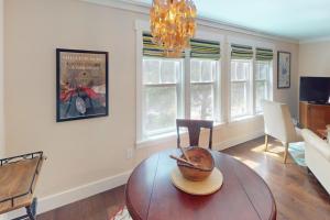 a living room with a table with a bowl on it at Hickory Trace Carriage Studio in Bluffton +4 photos