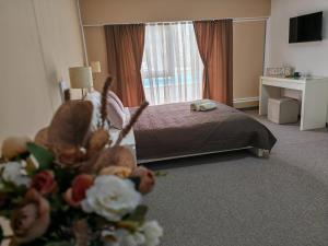 Postel nebo postele na pokoji v ubytování Aparthotel Waldinger Skopje