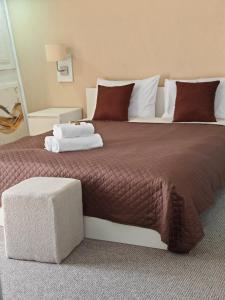 Postel nebo postele na pokoji v ubytování Aparthotel Waldinger Skopje