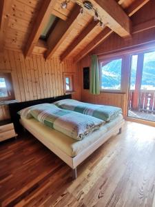 Postel nebo postele na pokoji v ubytování Chalet Edi