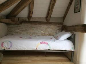 Postel nebo postele na pokoji v ubytování Les Tanneries
