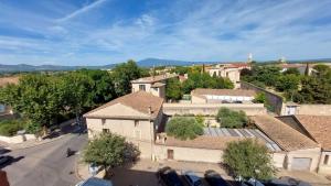 an aerial view of a small village with buildings at Ogooué appartement entier Lumineux 94m2 in Carpentras