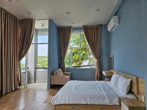 A bed or beds in a room at Vung Tau Villa mini sát biển - Gitico Homestay