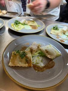 a slice of pizza on a plate on a table at Hotel Restaurant Brinckwirth in Ochtrup