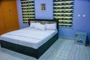 Postelja oz. postelje v sobi nastanitve Apartment in Port Harcourt - De Miruchen Home