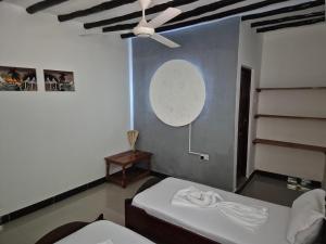 Postel nebo postele na pokoji v ubytování Ellavita Cottages Nungwi