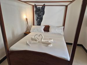 Postel nebo postele na pokoji v ubytování Ellavita Cottages Nungwi