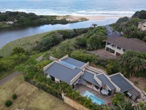 an aerial view of a house next to the ocean at 69 Lagoon House in Marina Beach