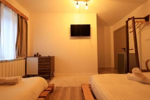 Postel nebo postele na pokoji v ubytování N'konak Guesthouse