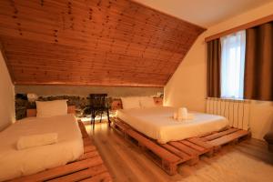Postel nebo postele na pokoji v ubytování N'konak Guesthouse
