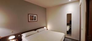 Postel nebo postele na pokoji v ubytování Hotel Mariani