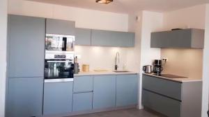 Kuchyň nebo kuchyňský kout v ubytování Superbe appartement neuf avec terrasse et parking privé