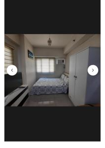 a small bedroom with a bed and a window at My Quiet Place at The Beacon - Makati City in Manila