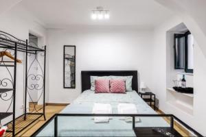 Ένα ή περισσότερα κρεβάτια σε δωμάτιο στο Casa S. Tiago
