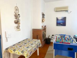 a living room with a table and a lego table at Pearl of the sea in Arenella