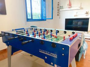 a blue masterro foosball table in a room at Pearl of the sea in Arenella +17 photos