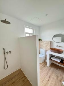 a bathroom with a toilet and a sink at Casa Maruxa in Valdoviño +63 photos