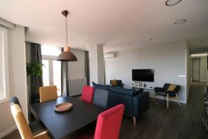 Et tv og/eller underholdning på Ático en la Gran Vía con Terraza al Palacio Real