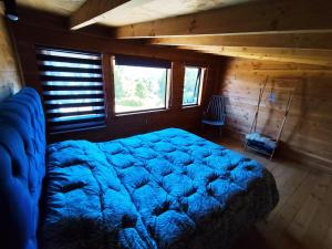 Postel nebo postele na pokoji v ubytování Cabañas de montaña Ruka kizel