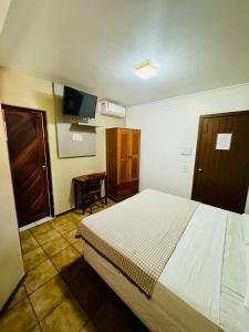 Postel nebo postele na pokoji v ubytování Pousada Bossa Nova